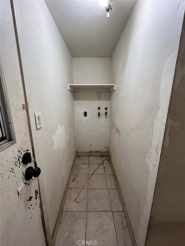 laundry room featuring washer hookup, laundry area, electric dryer hookup, and light tile patterned floors