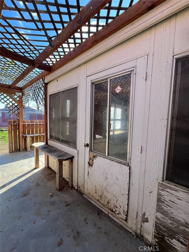 view of patio / terrace with fence and a pergola