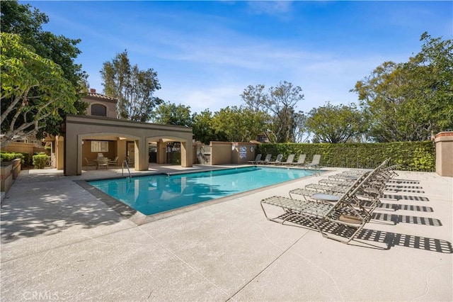 pool with a patio area