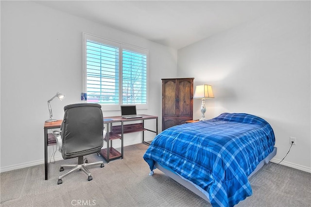 carpeted bedroom with baseboards