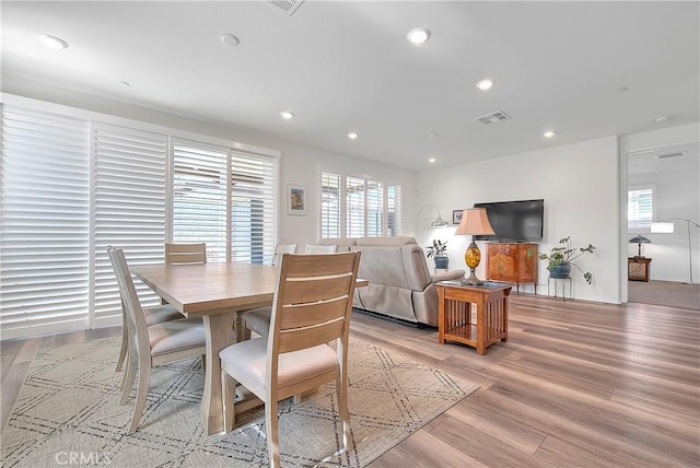 dining area with visible vents, recessed lighting, and light wood-type flooring