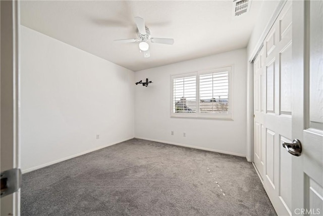 unfurnished bedroom with carpet, a closet, visible vents, a ceiling fan, and baseboards