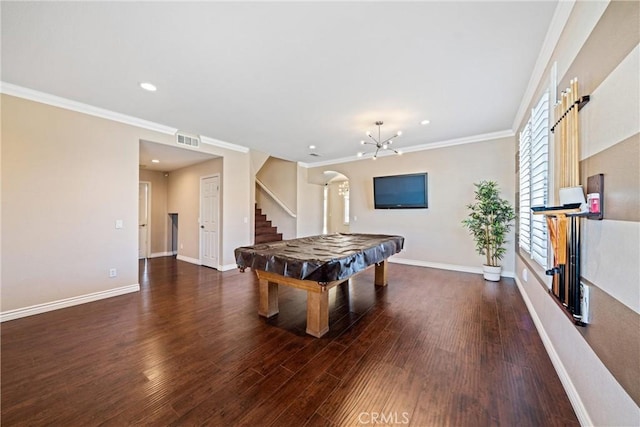 playroom featuring visible vents, crown molding, baseboards, and wood finished floors