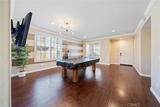 game room with a healthy amount of sunlight, ornamental molding, and wood finished floors