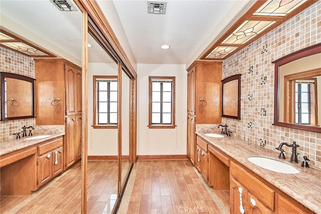 bathroom featuring a sink and visible vents