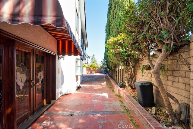 view of home's exterior with a fenced backyard and a patio