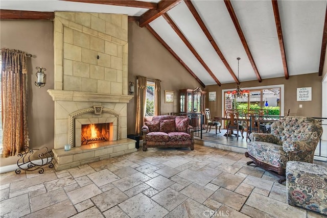 160 Summit Rd, La Verne, CA 91750 - living room featuring high vaulted ceiling, stone tile flooring, plenty of natural light, a fireplace, and beam ceiling