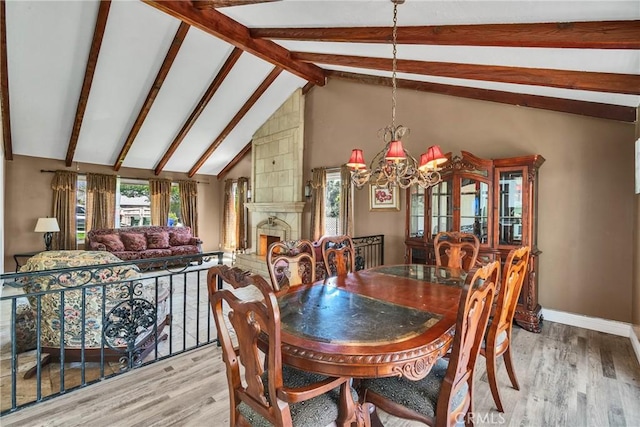 160 Summit Rd, La Verne, CA 91750 - dining room featuring a chandelier, light wood-style floors, baseboards, and a fireplace