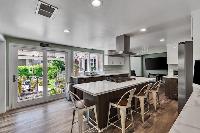 160 Summit Rd, La Verne, CA 91750 - kitchen with island exhaust hood, a sink, stainless steel gas cooktop, modern cabinets, and recessed lighting