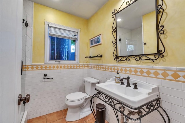 160 Summit Rd, La Verne, CA 91750 - bathroom featuring tile walls, toilet, a wainscoted wall, and tile patterned floors