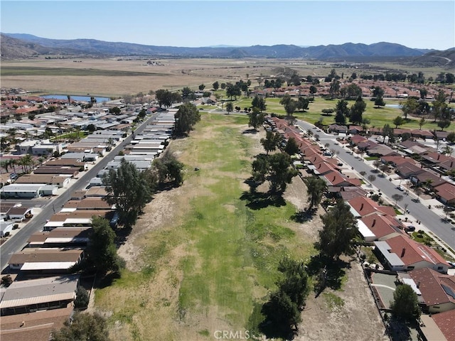 birds eye view of property featuring a residential view and a water and mountain view