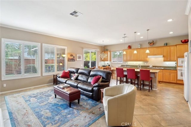 living area featuring light tile patterned floors, baseboards, visible vents, and recessed lighting