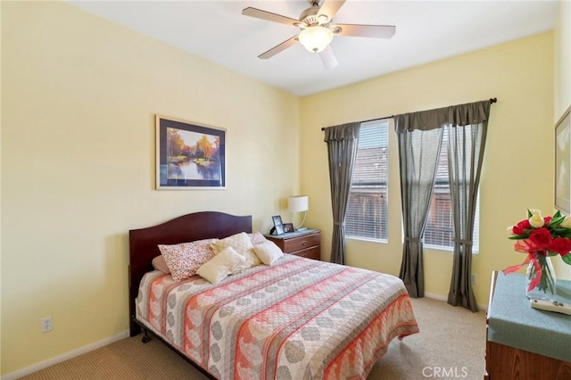 bedroom with carpet, ceiling fan, and baseboards