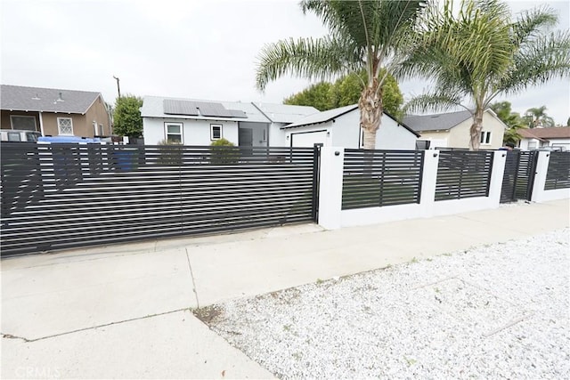 view of gate featuring a fenced front yard