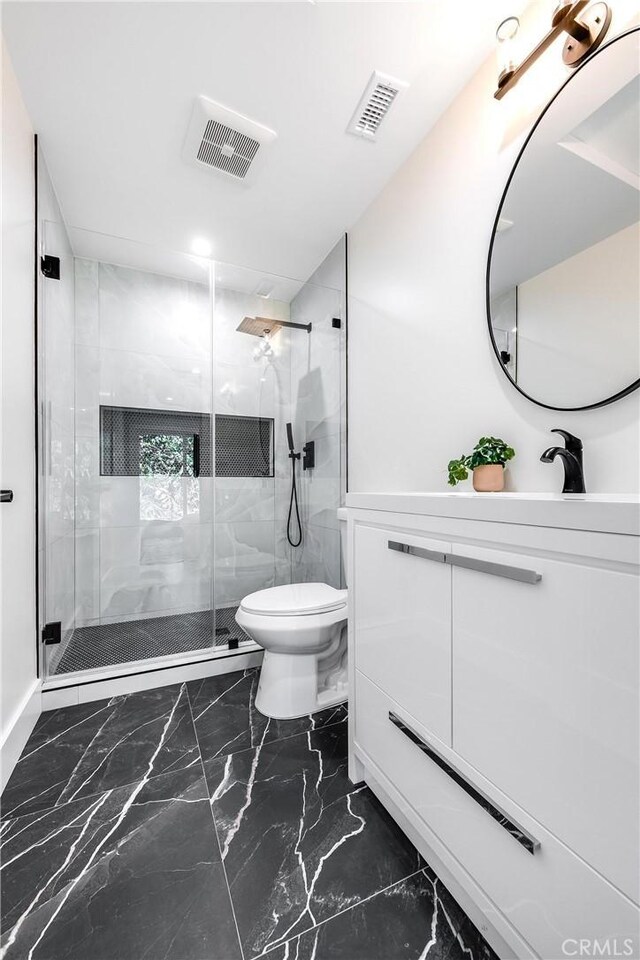 full bath featuring toilet, marble finish floor, a stall shower, and visible vents