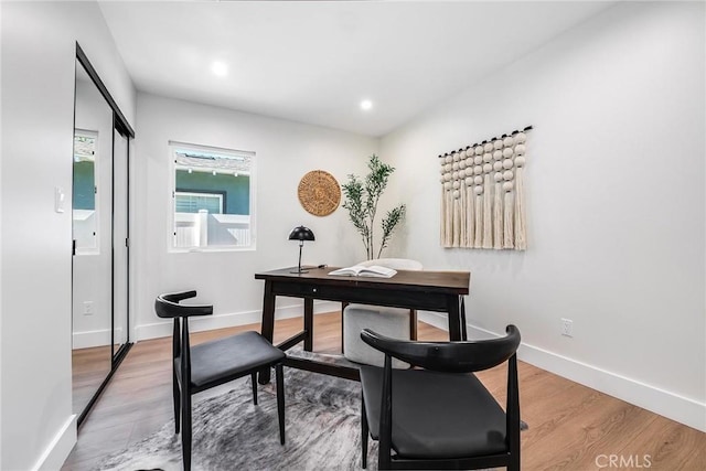 office space featuring recessed lighting, baseboards, and wood finished floors