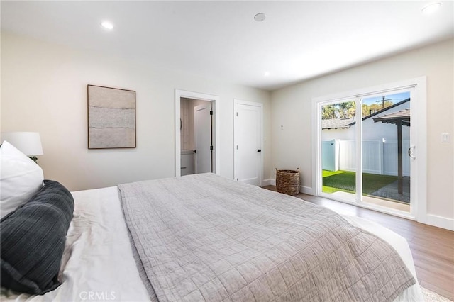 bedroom with access to outside, baseboards, wood finished floors, and recessed lighting