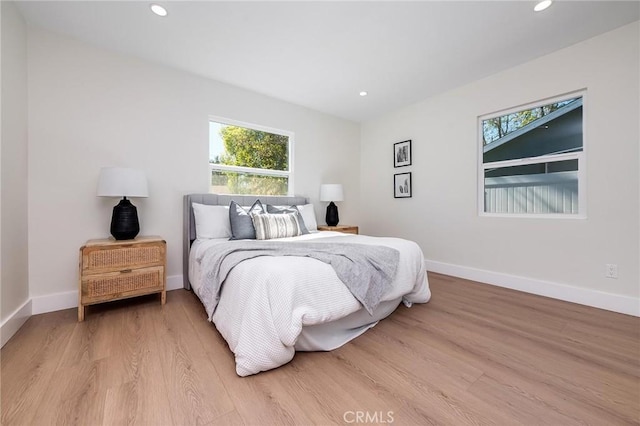 bedroom featuring light wood-style flooring, baseboards, and recessed lighting