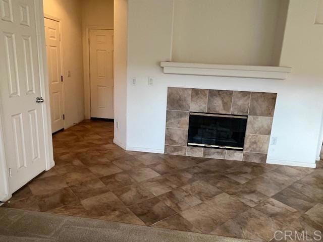 room details with a fireplace and baseboards