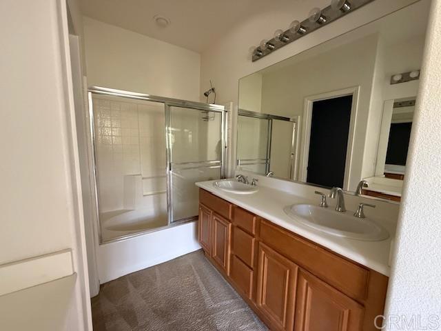 bathroom with double vanity and a sink