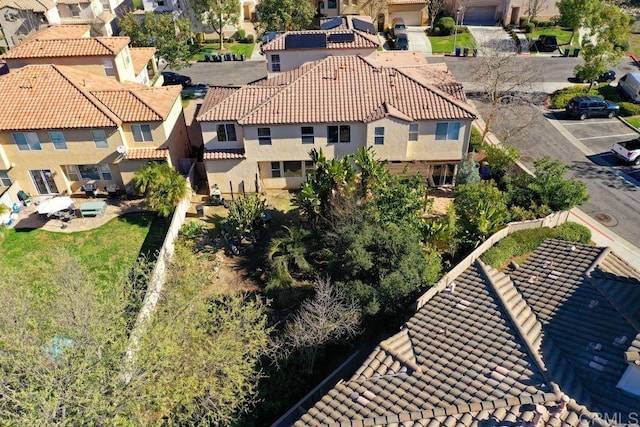 birds eye view of property with a residential view