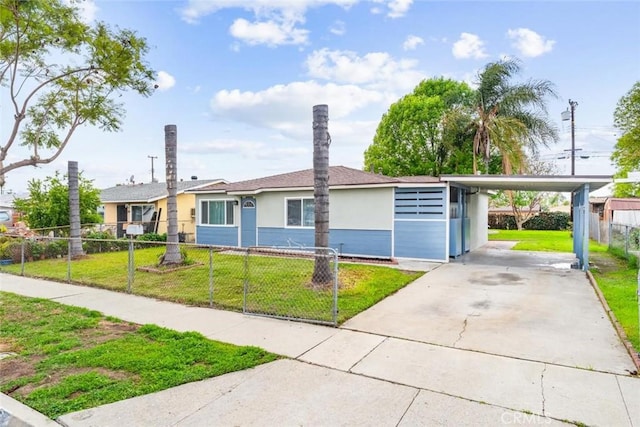 ranch-style home featuring a fenced front yard, stucco siding, driveway, and a front lawn