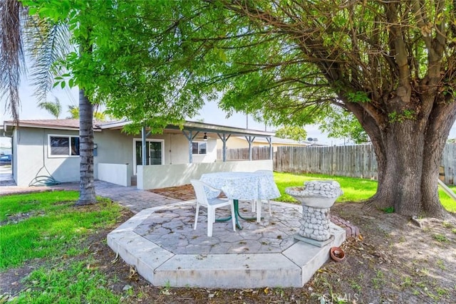 view of yard with a patio and fence