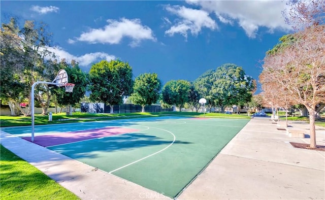 view of basketball court with community basketball court and fence