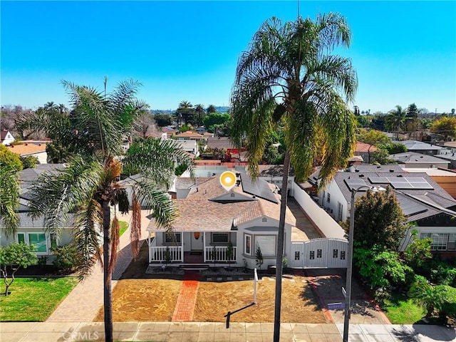 birds eye view of property with a residential view