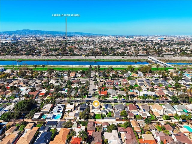 drone / aerial view featuring a water view and a residential view