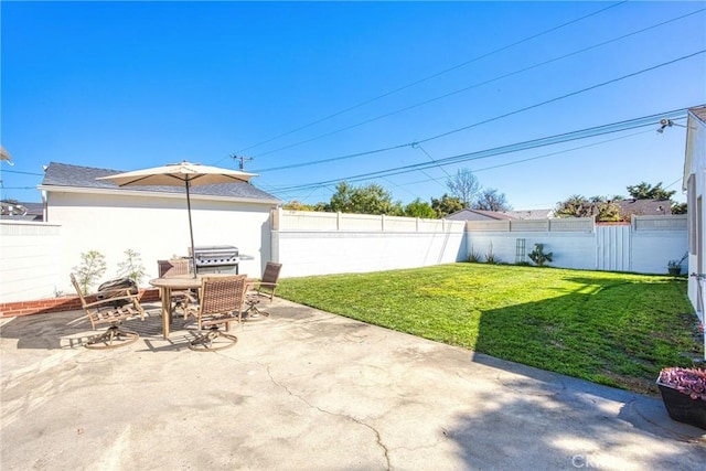 view of patio / terrace with a fenced backyard, a grill, and outdoor dining space