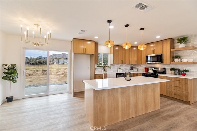 kitchen featuring stainless steel appliances, open shelves, visible vents, and decorative backsplash