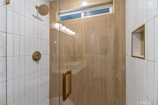 interior details featuring a stall shower