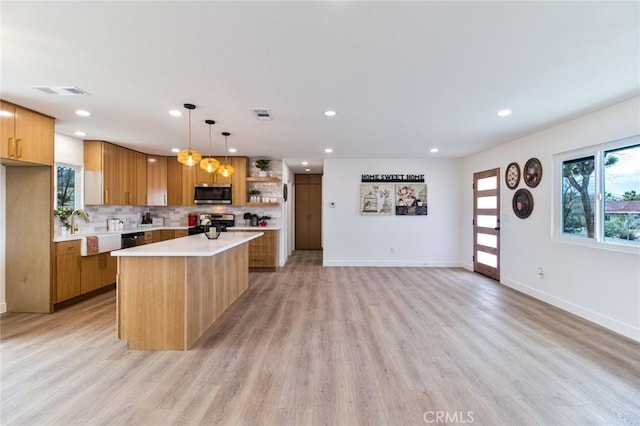 kitchen with stainless steel appliances, visible vents, light countertops, decorative backsplash, and open shelves