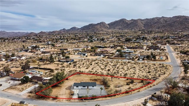 drone / aerial view with a desert view and a mountain view