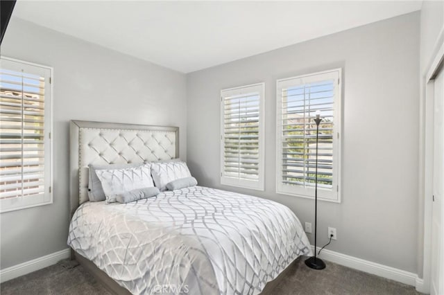 carpeted bedroom with baseboards