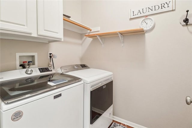 laundry area featuring washer and dryer, baseboards, and cabinet space