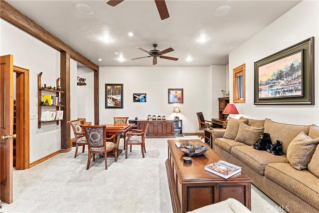 living area with a ceiling fan, recessed lighting, light colored carpet, and baseboards