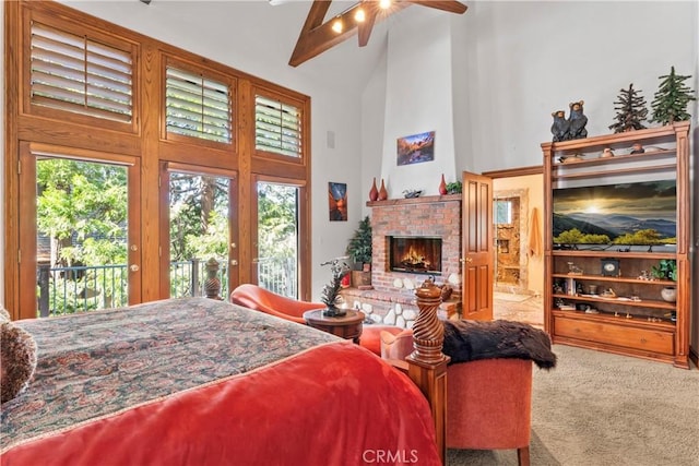 bedroom featuring carpet floors, a brick fireplace, high vaulted ceiling, access to outside, and beamed ceiling