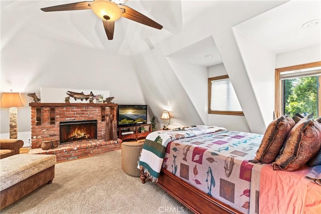 bedroom featuring ceiling fan, carpet floors, and a fireplace