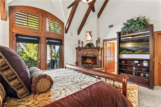 carpeted bedroom featuring visible vents, beamed ceiling, access to exterior, a brick fireplace, and high vaulted ceiling