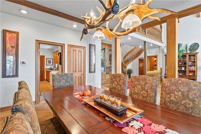 carpeted dining area featuring beamed ceiling, stairway, recessed lighting, and a notable chandelier