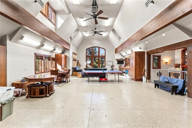 misc room with high vaulted ceiling, beam ceiling, ceiling fan, and speckled floor