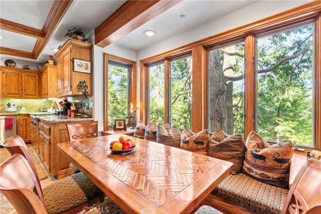 dining space with beam ceiling and recessed lighting