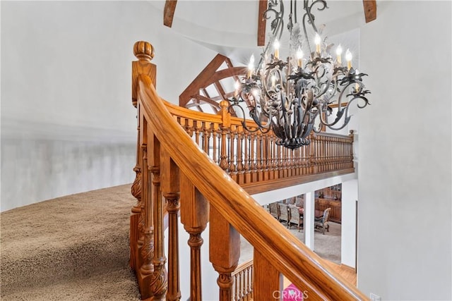 145 Pheasant Run, Lake Arrowhead, CA 92352 - stairway with a chandelier, carpet flooring, and beam ceiling