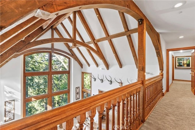 hall with vaulted ceiling with beams, light carpet, and recessed lighting