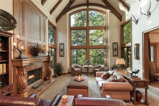 145 Pheasant Run, Lake Arrowhead, CA 92352 - carpeted living area with high vaulted ceiling, beam ceiling, and a high end fireplace