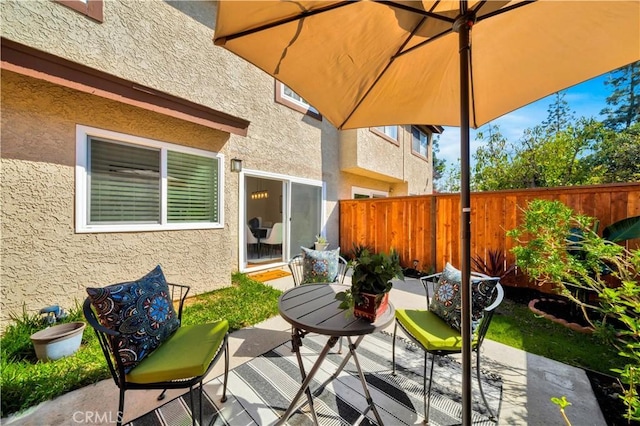 view of patio / terrace featuring outdoor dining space and fence