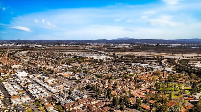 birds eye view of property with a mountain view and a residential view