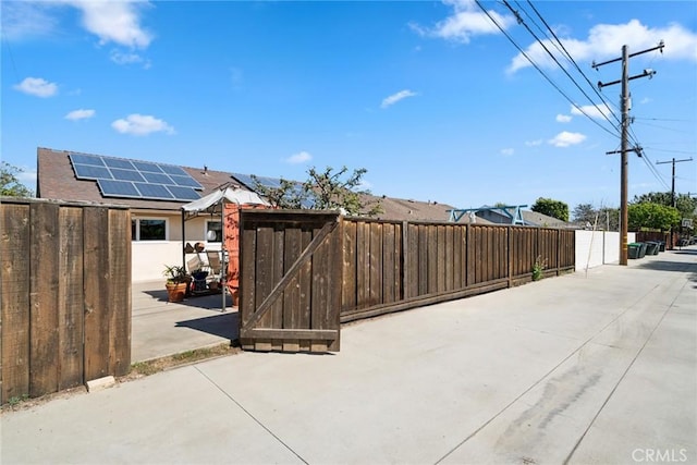 view of patio with a gate and fence